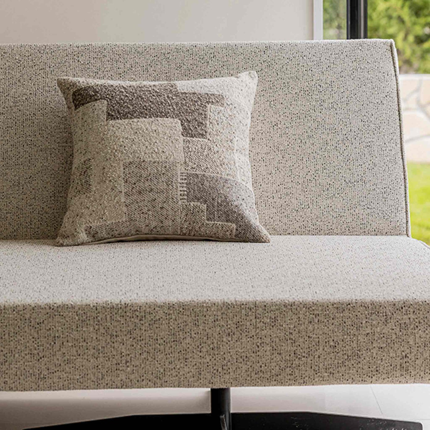 Chic neutral khaki geometric cushion covers on sofa.