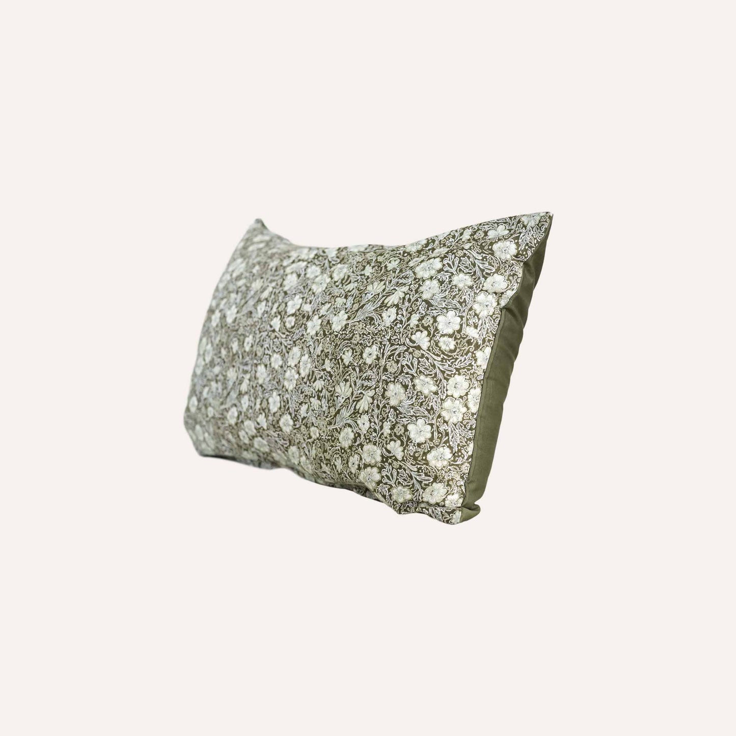 Floral pattern olive base lumbar cushion.