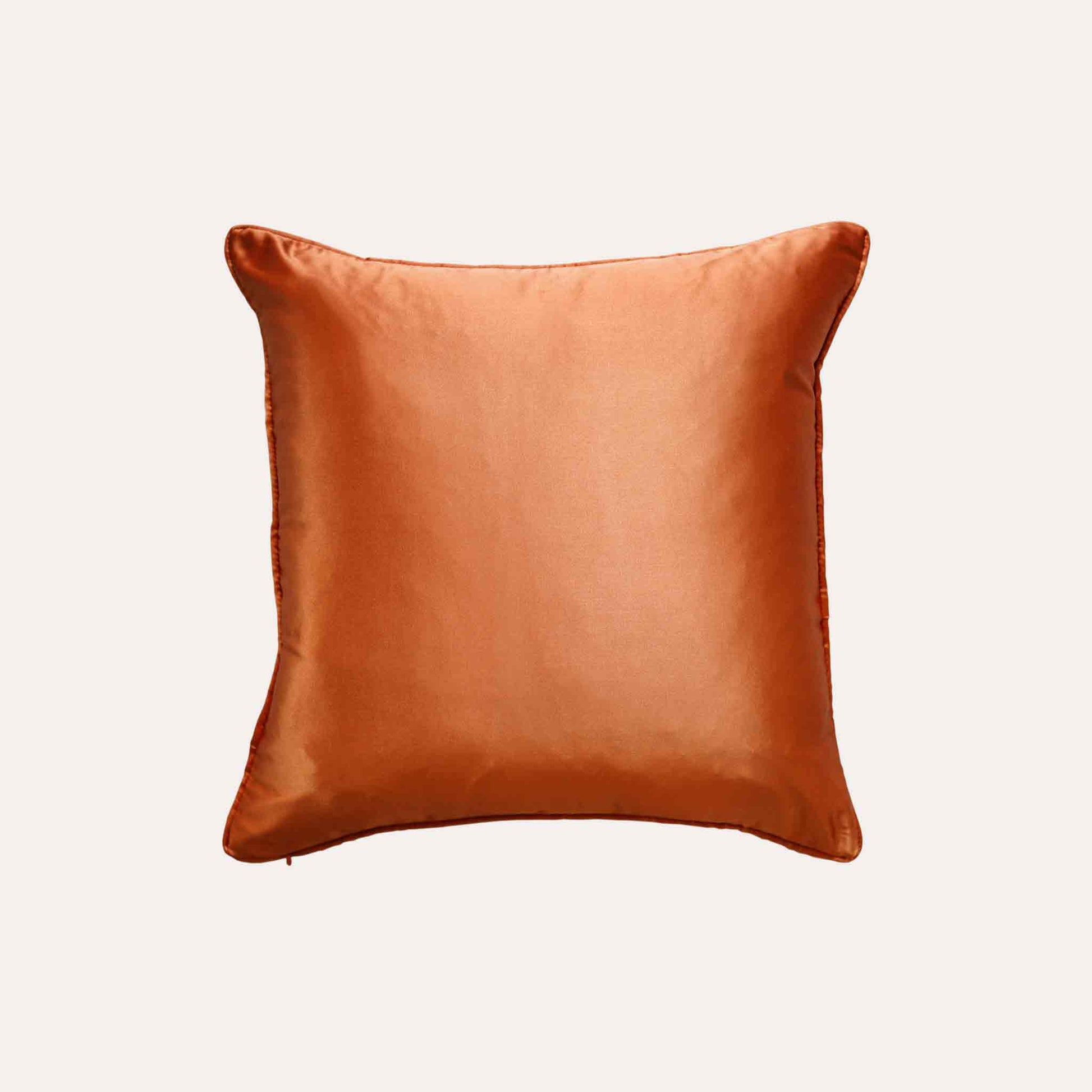 Eye-catching orange and beige abstract pattern polyester decor cushion cover with solid orange back.