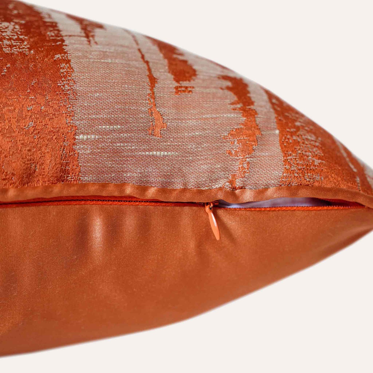Eye-catching orange and beige abstract pattern polyester decor cushion cover with invisible zipper.