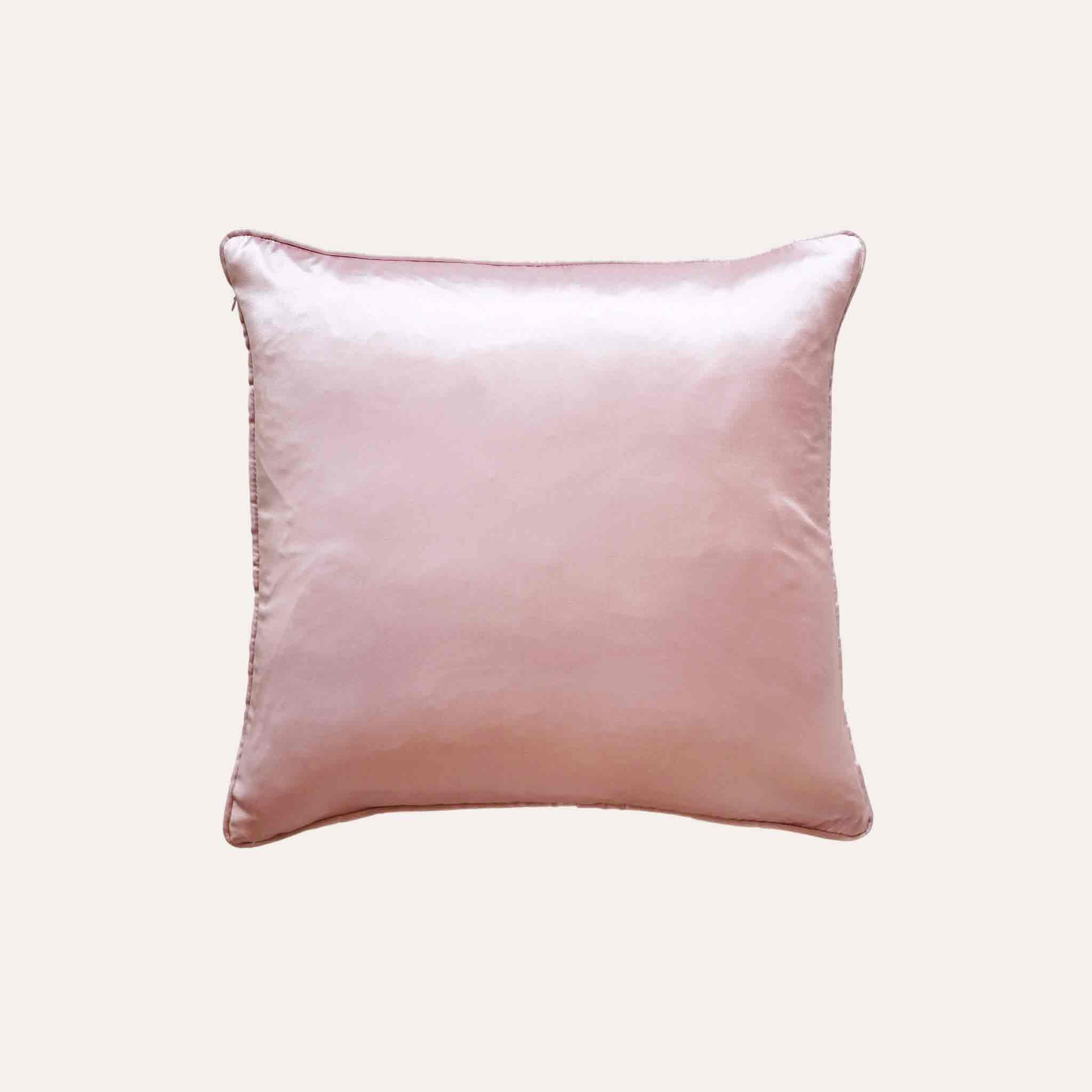 Gentle pink tropical palm leaves polyester decor cushion cover with solid pink back.