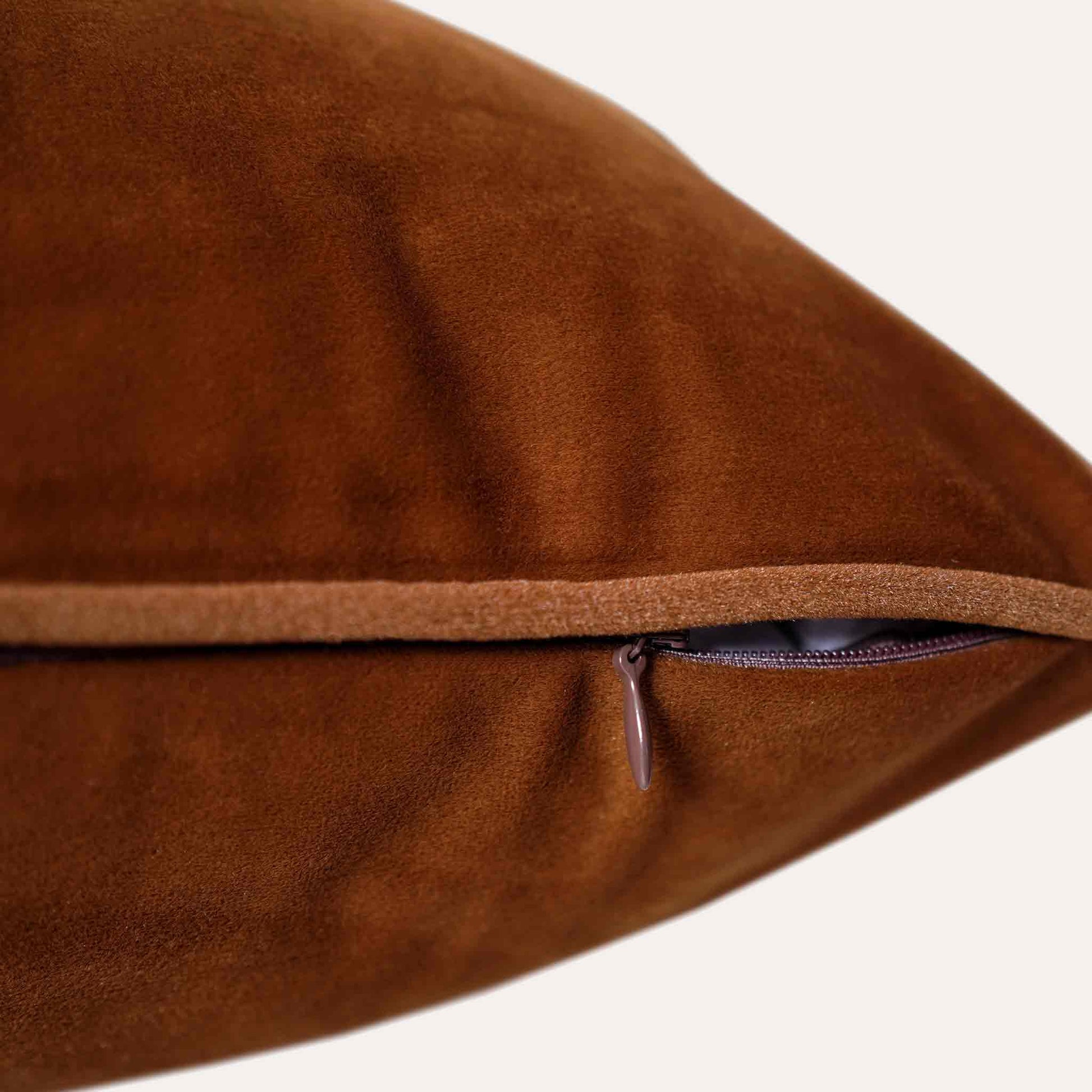 Soft raw umber velvet with stylish piping cushion cover with invisible zipper.