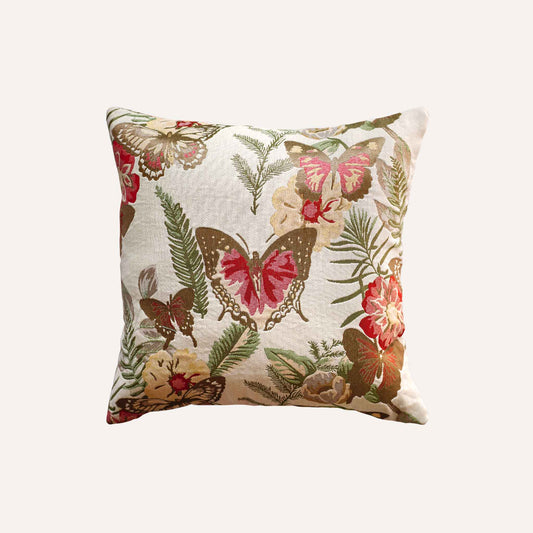Red butterfly and floral pattern cushion.