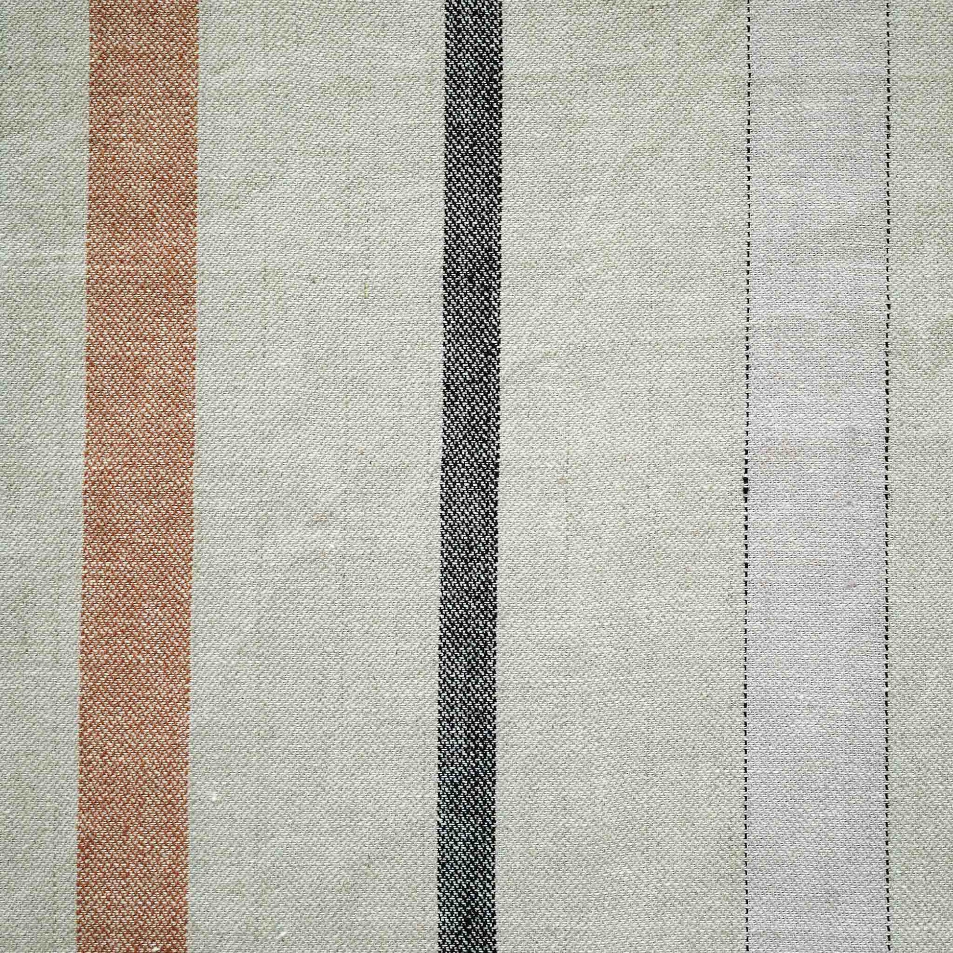 Red and grey stripes on grey background cushion with welt edges.