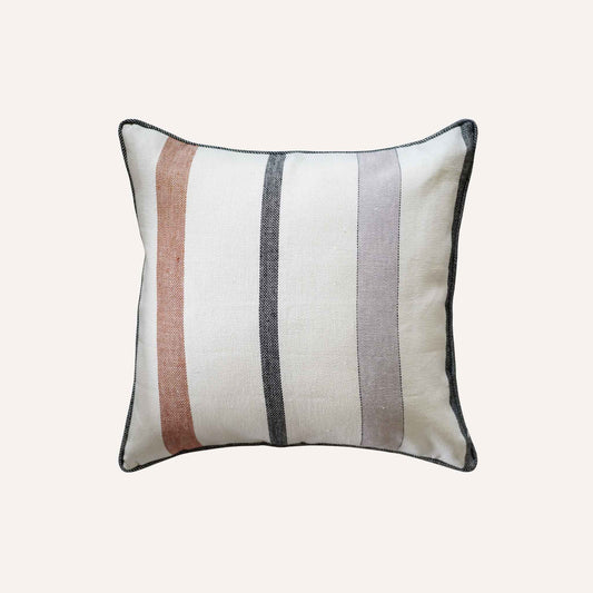 Red and grey stripes on white background cushion with welt edges.