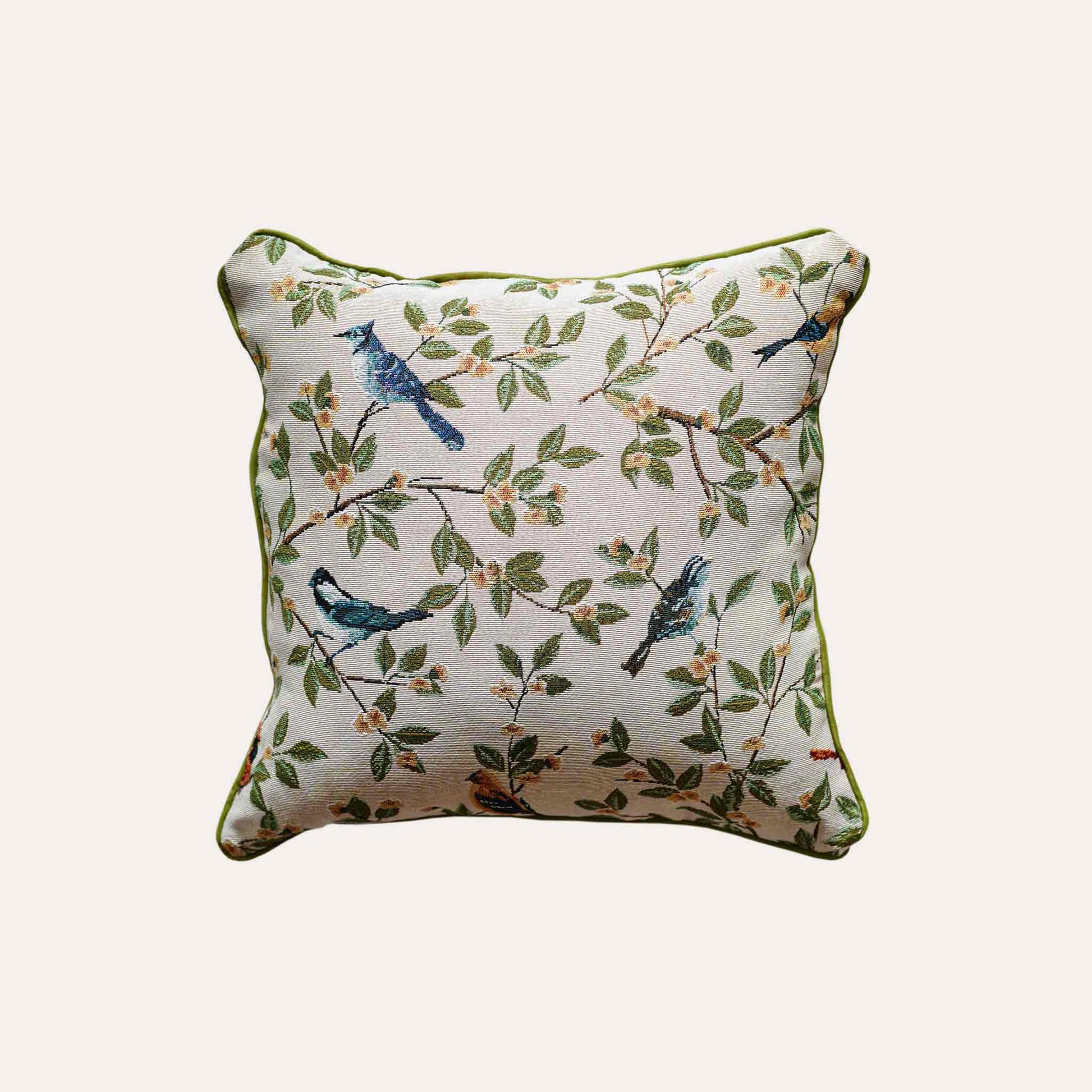A stylish cushion cover adorned with retro birds on branches.
