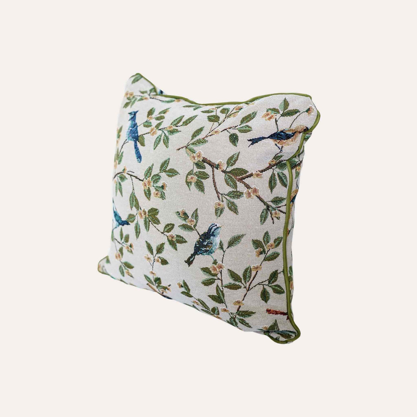 A stylish cushion cover adorned with retro birds on branches.