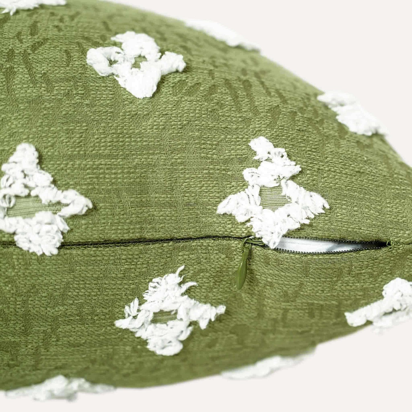 White rhombus flower in sage green cushion cover with invisible zipper.