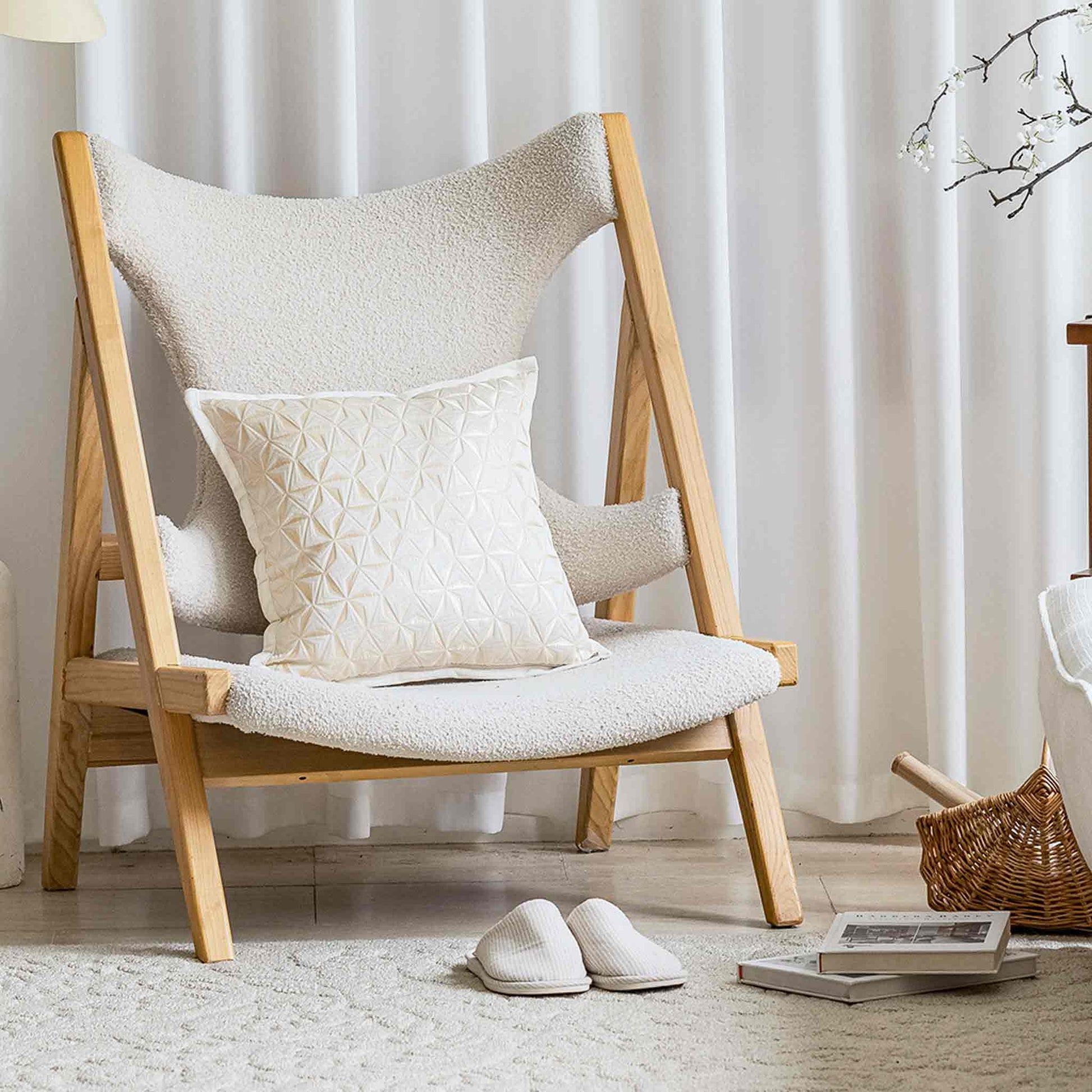 Elegant jacquard cushion covers with windmill motif and subtle 3D effect on white chair.