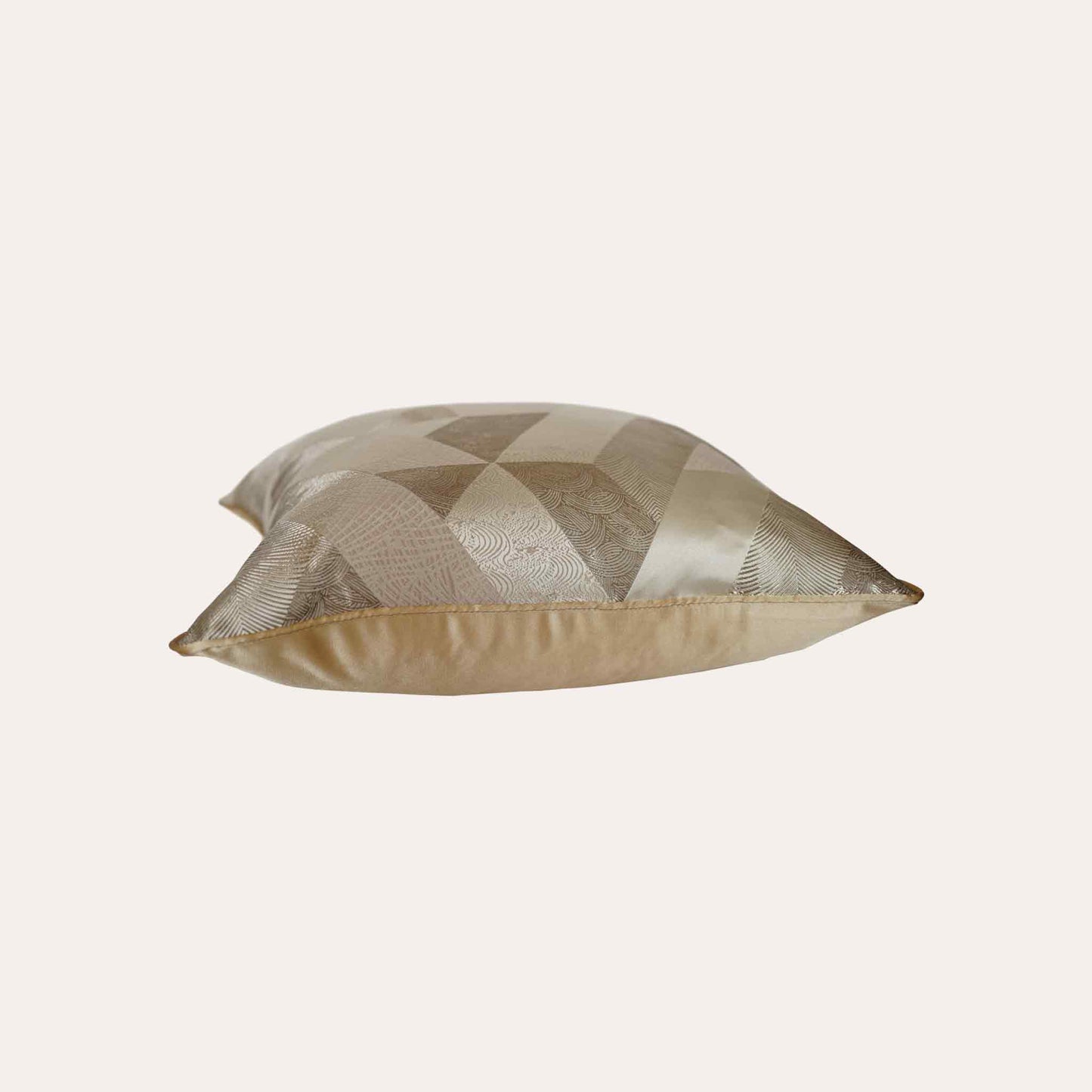 Elegant champagne gold color cushion cover showcasing a unique geometric pattern.