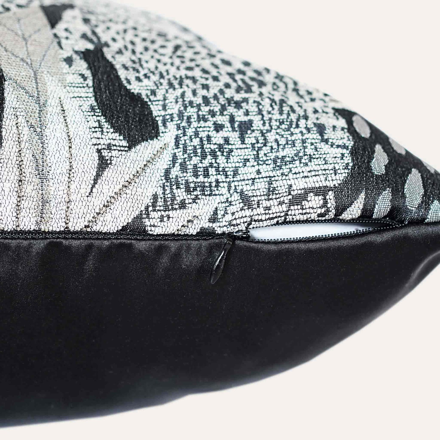 Black and gold jungle animal cushion cover with invisible zipper.