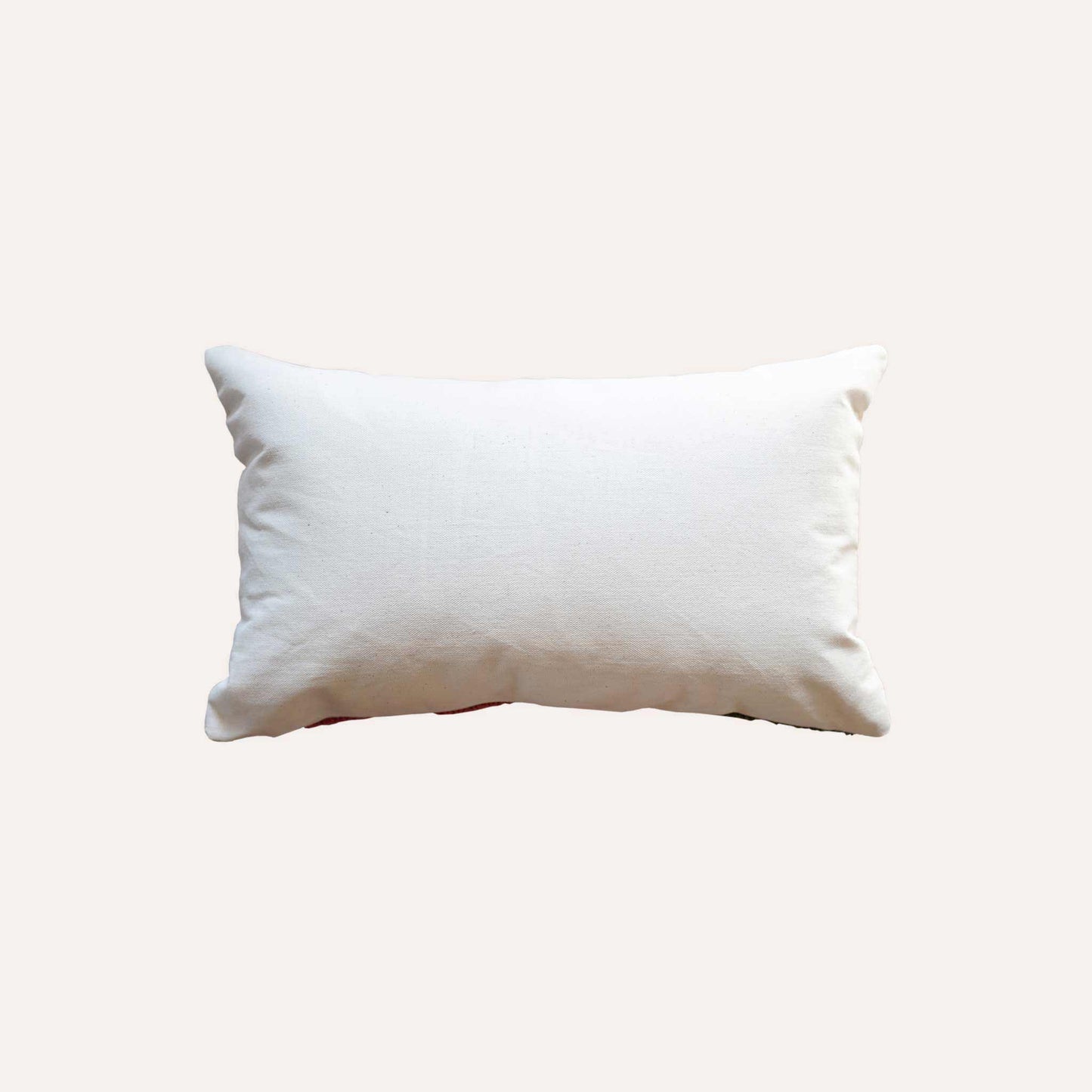 Tufted floral patterns lumbar cushion cover with white back.