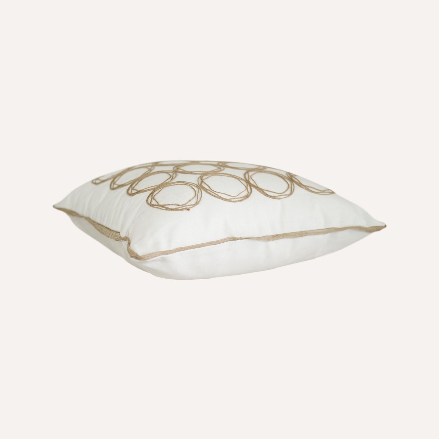 Round twine design cushion with white background adds a modern touch to home decor.