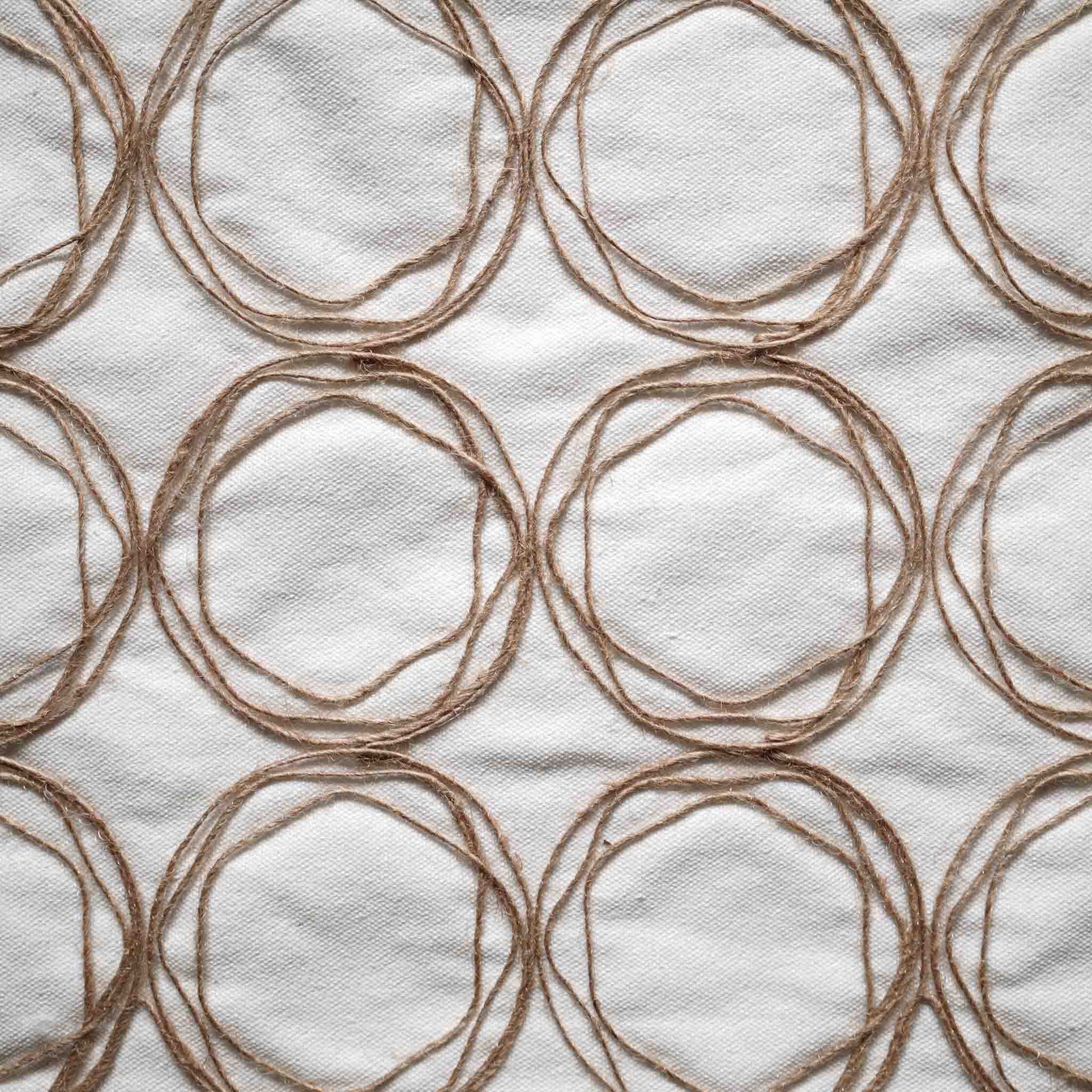 Round twine design cushion with white background adds a modern touch to home decor.