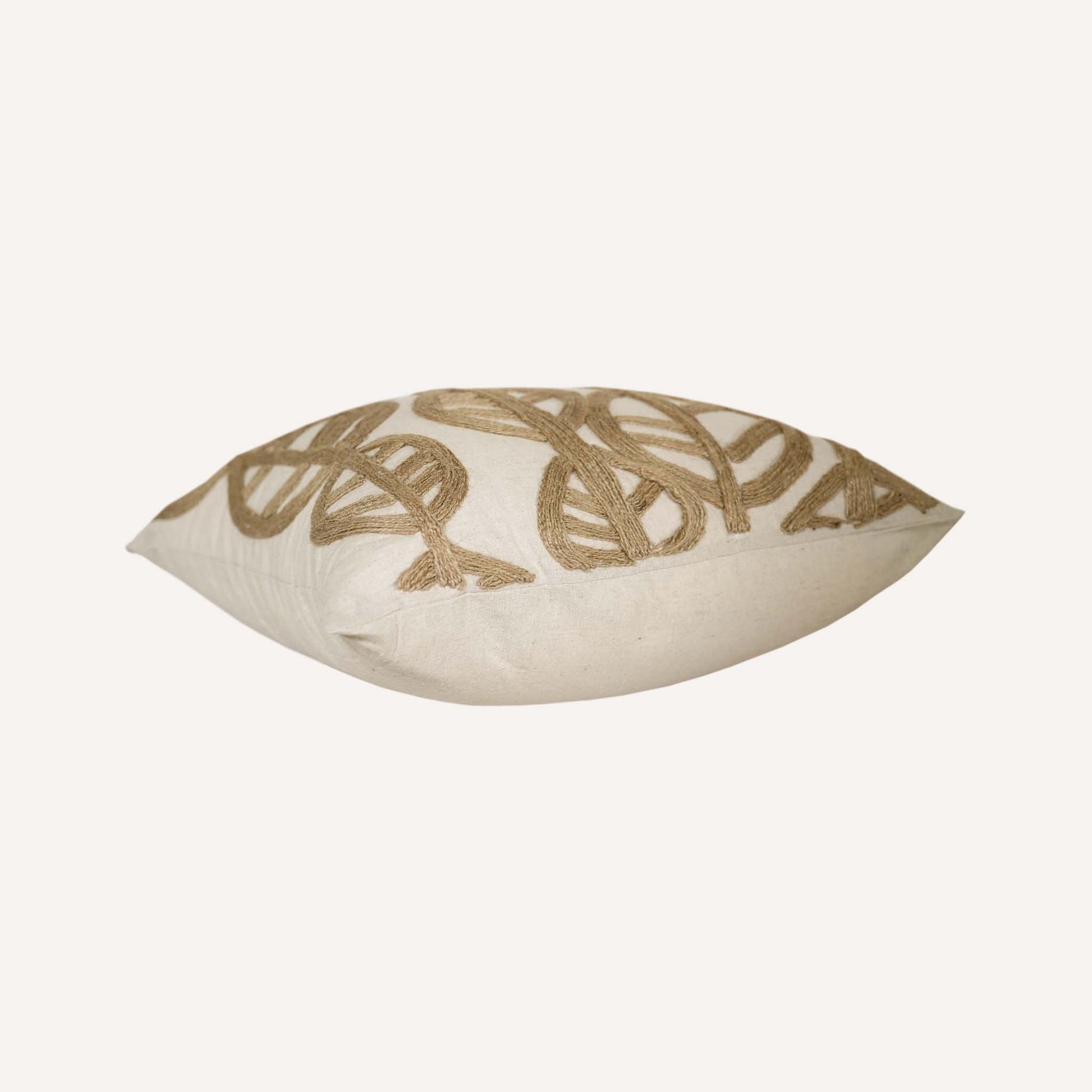The cushion features a decorative twine leaf design that combines natural beauty with comfort.