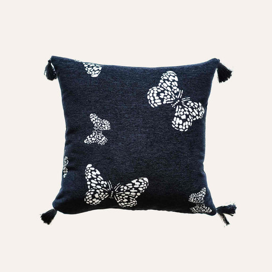 White butterfly on black background, fringed chenille cushion cover.