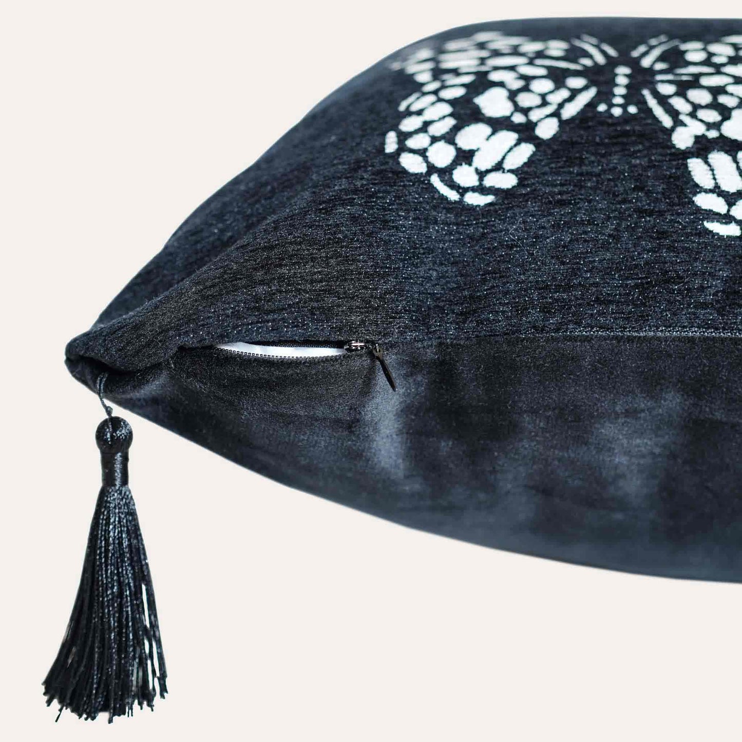White butterfly on black background, fringed chenille cushion cover with invisible zipper.