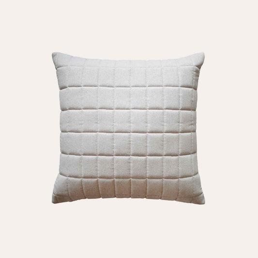 Soft beige quilted showcasing a geometric design cotton cushion cover.