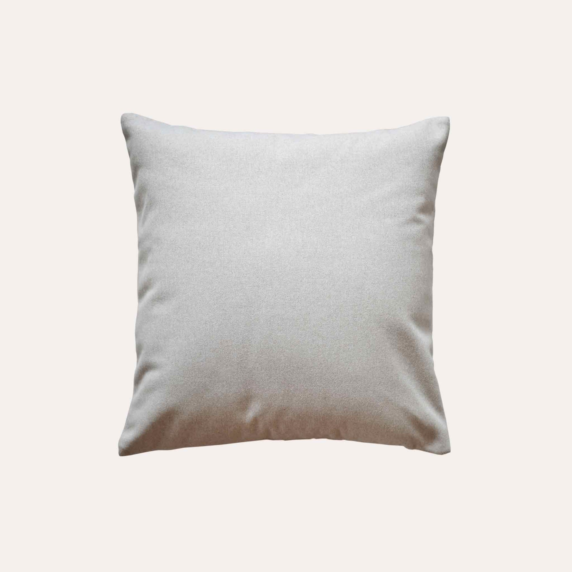 Soft beige quilted showcasing a geometric design cotton cushion cover with solid beige back.
