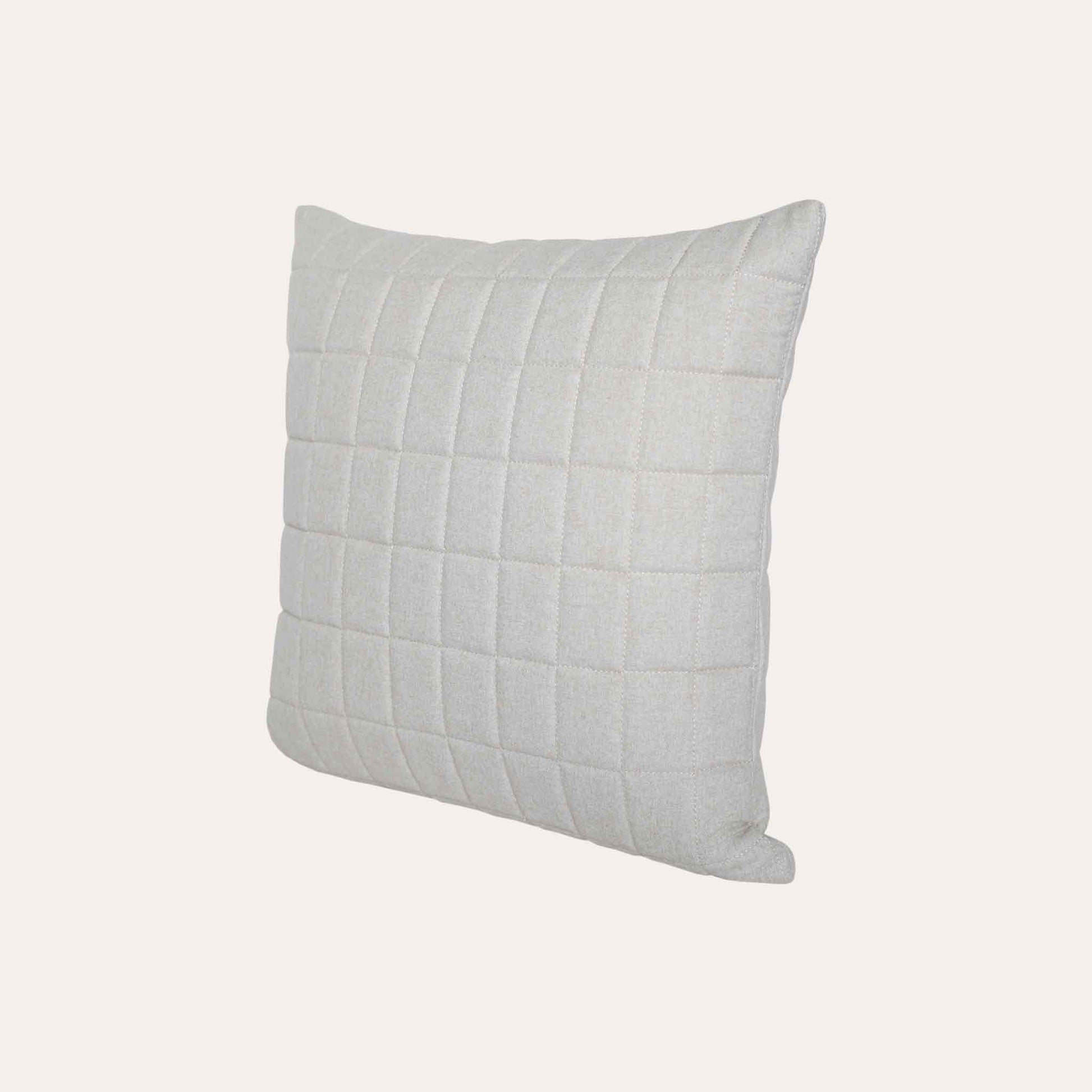 Soft beige quilted showcasing a geometric design cotton cushion cover.