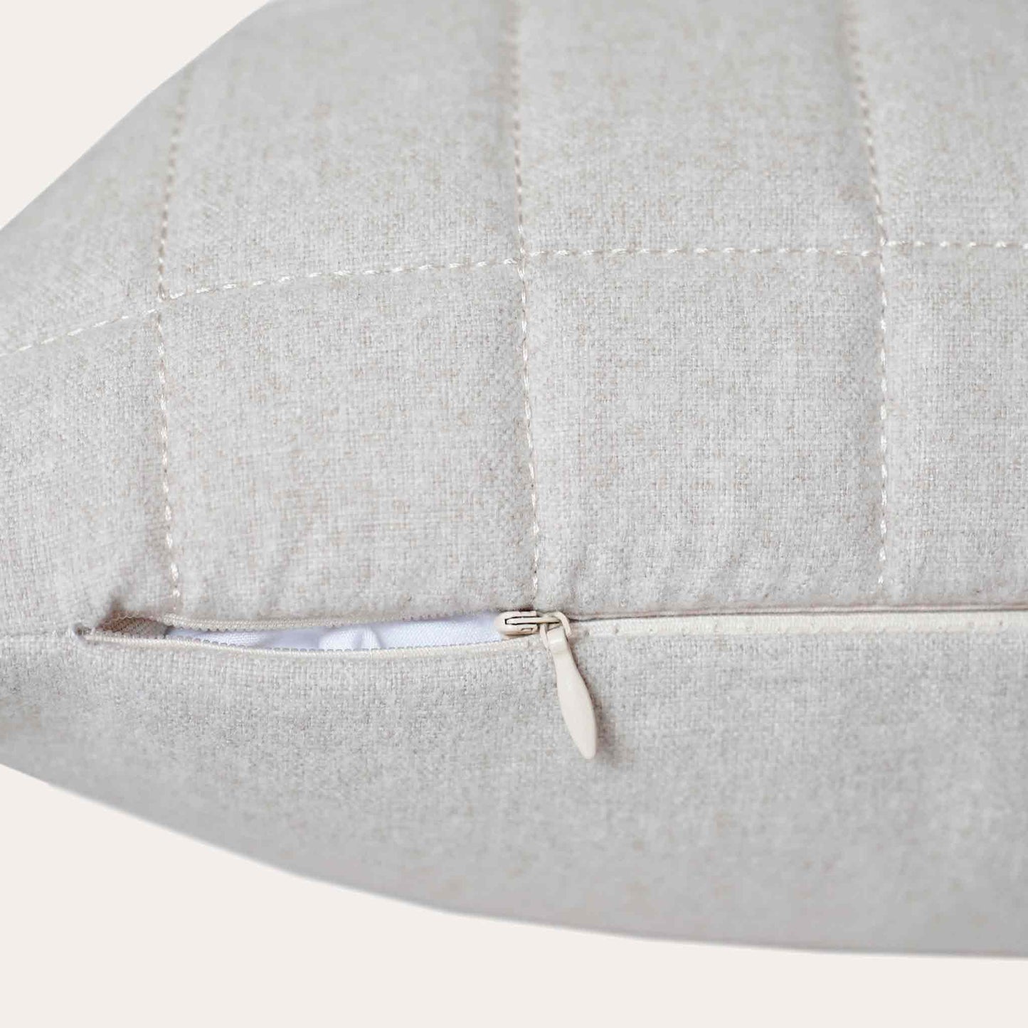 Soft beige quilted showcasing a geometric design cotton cushion cover with invisible zipper.