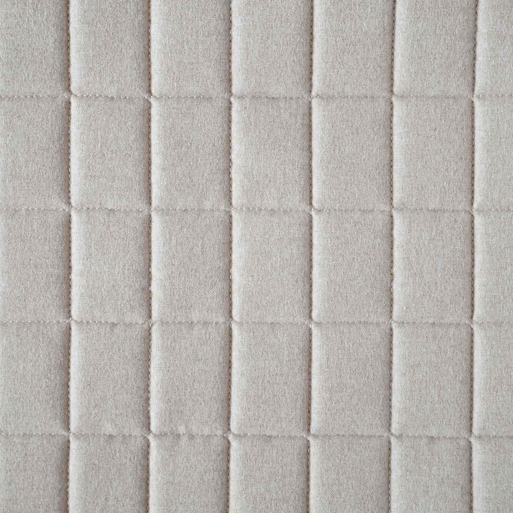 Soft beige quilted showcasing a geometric design cotton cushion cover.