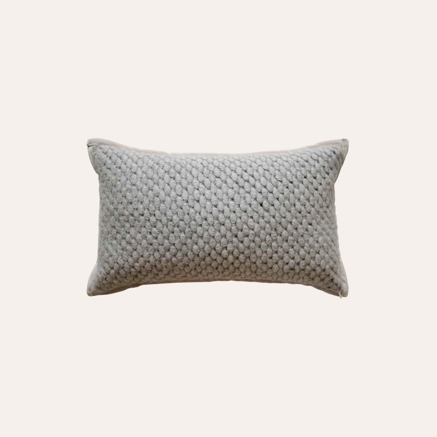 Grey woven textured wool lumbar cushion cover.