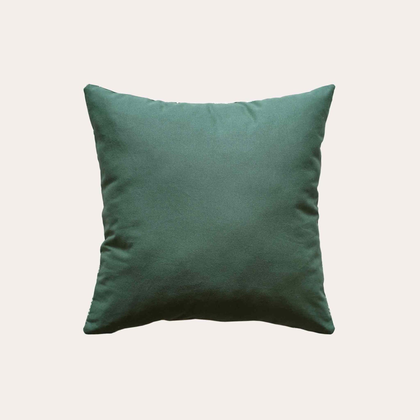 White straw embroidered dark green background cushion cover with solid green back.