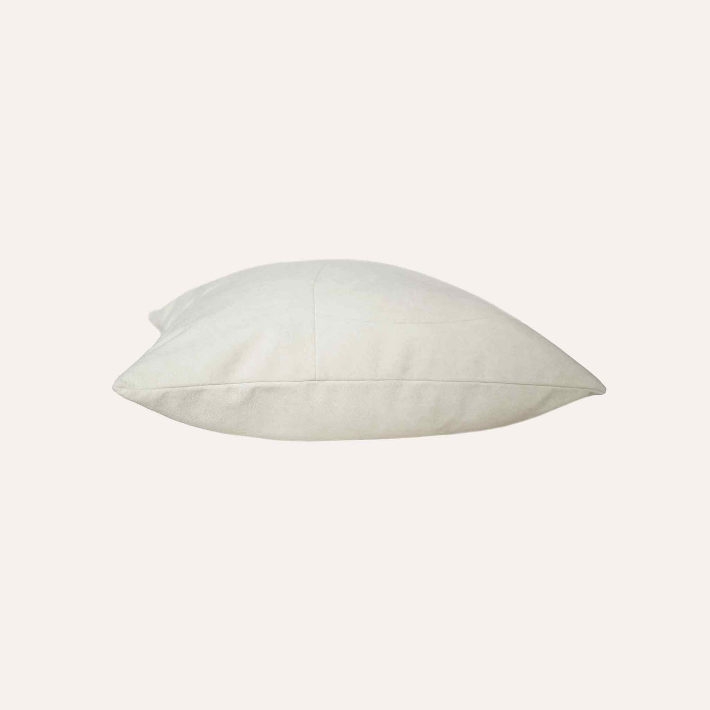 Chic white curved patchwork cushion cover.