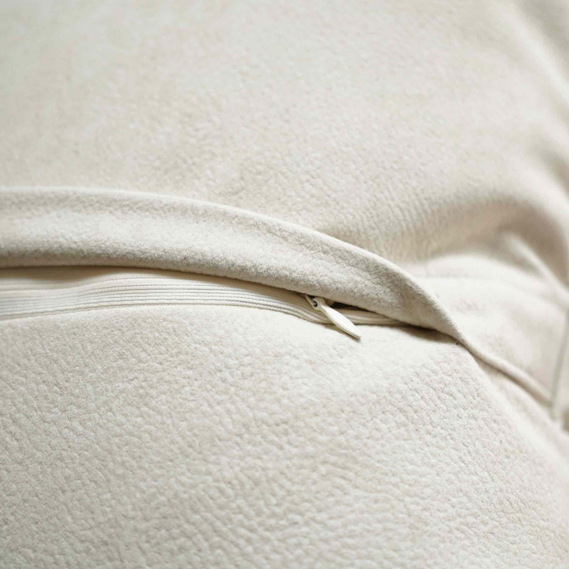 Chic white curved patchwork cushion cover with invisible zipper.