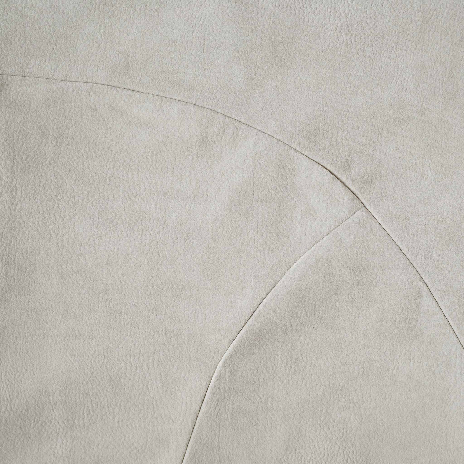 Chic white curved patchwork cushion cover.