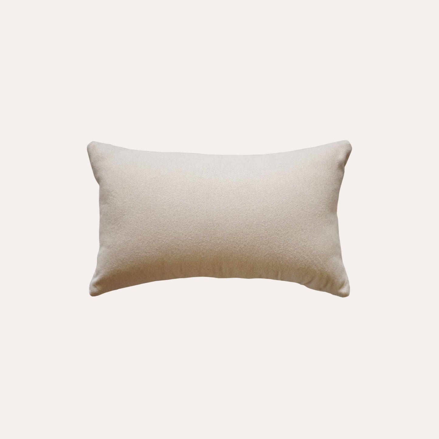 White and beige serrated pattern woolen decorative cushion cover with beige back.