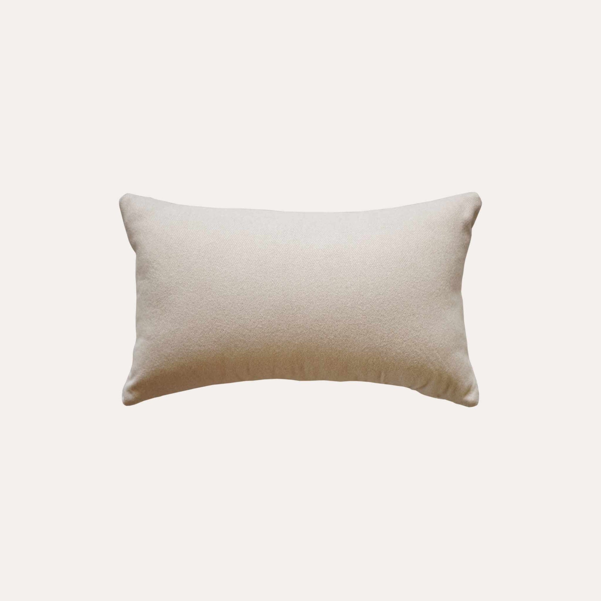 White and beige serrated pattern woolen decorative cushion cover with beige back.