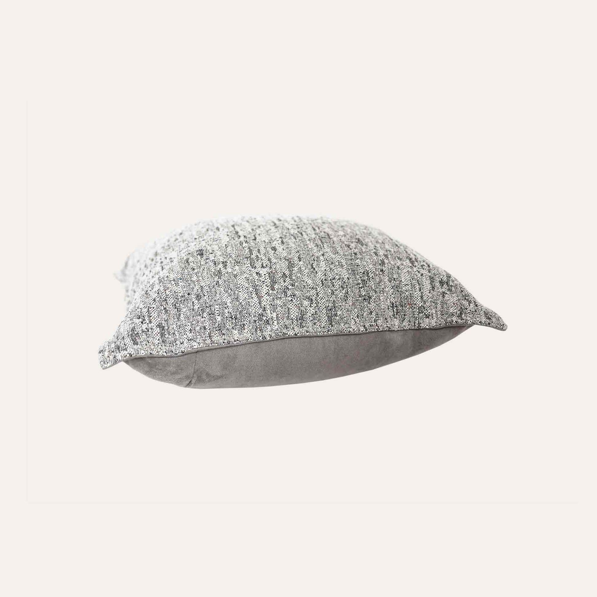 Gray and white mixed color woven texture cushion cover.